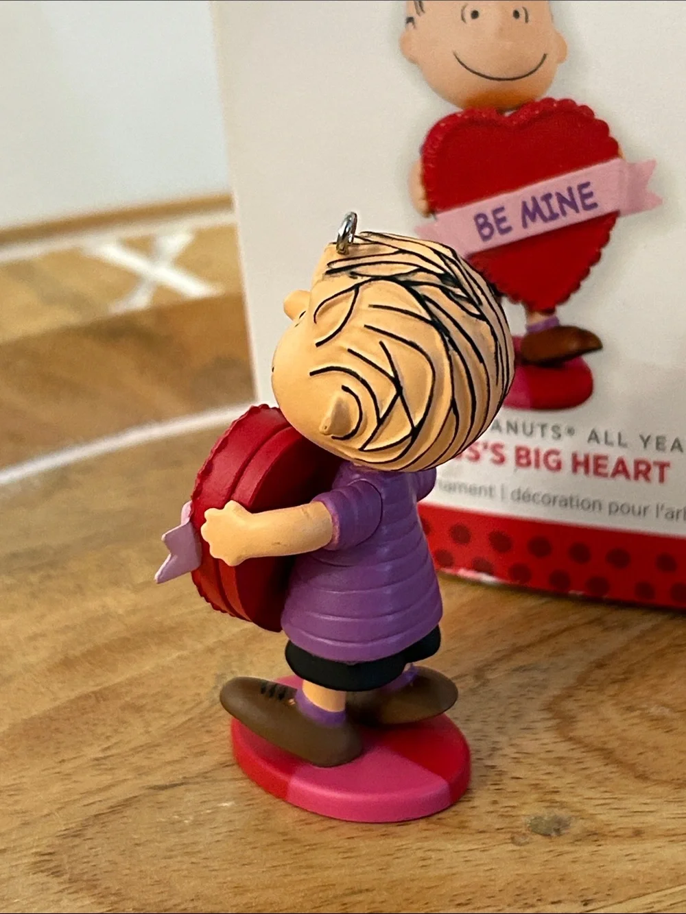 Hallmark holding gold shelves